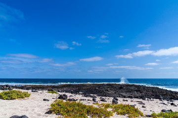Spain, Lanzarote, Rough waves of atlantic ocean at black and white beach on nother coast