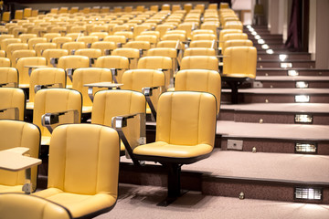 Fototapeta premium Row of yellow seat in auditorium