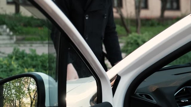 Driver closing the hood of the car. Evaluation of the technical condition of the car yourself