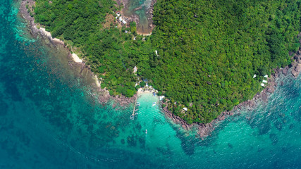 Top view or Aerial view of tropical island jungle with palms and emerald clear water of island .Royalty high quality stock image in Phu Quoc, Kien Giang, Vietnam