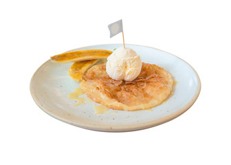 Sweet roti served with vanilla icecream and fresh banana isolated.