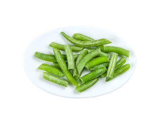 Cut green beans in a white plate, isolated, on white background with clipping path