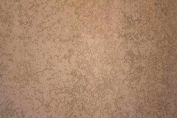 pink gray beige concrete wall with embossed pattern. rough surface texture