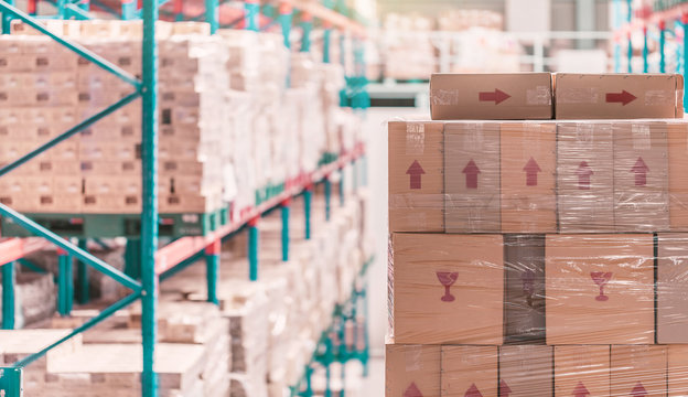 Corrugated Paperboard Carton Stacked On Shelf In Warehouse Or Depot