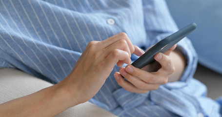 Woman use of smart phone at home
