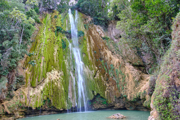 Scenic view of El Limon waterfall in jungles of Samana peninsula in Dominican Republic. Beautiful summer look of cascade of waterfall in tropical forest on paradise island in Caribbean sea © Petr Zyuzin