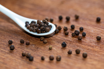Pepper seeds  on wooden background