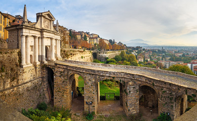 View of Bergamo with Porta San Giacomo gate, Sant Andrea platform of Venetian Walls at morning. Italy