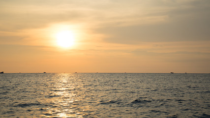 Landscape of beautiful sunset in Phu Quoc island sandy beach with colorful sky and dramatic clouds over wavy sea	