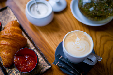 Croissants for breakfast. A french croissant on plate top view