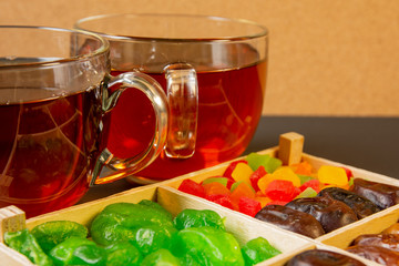 Oriental sweets, dried fruit with a cups of tea