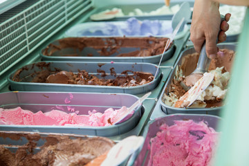 Trays of ice cream. Man serving ice cream.