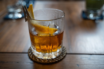 Old fashioned cocktail served in a whiskey glass at the restaurant. Copy space