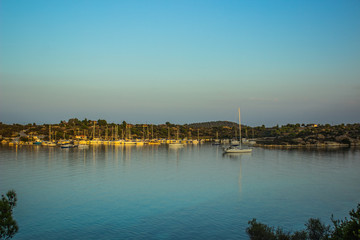 sea bay calming outdoor scenery landscape with yachts on water surface in evening silent natural environment 