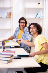 Two male students in the classroom