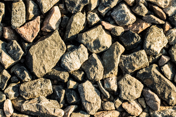 Granite gravel of macadam, Rock gray crushed for construction on the ground, Scree texture background