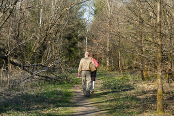 Senior couple walking in the Perlacher Forst