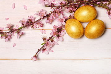 Easter eggs on wooden background. Top view with copy space.