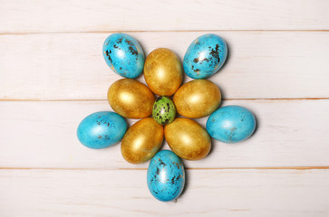 Obraz na płótnie Canvas Easter eggs on wooden background. Top view with copy space.