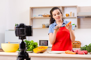 Young female vegetarian recording video for her blog