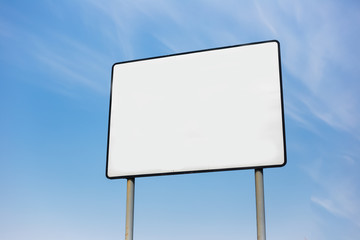 Empty billboard blank for advertising, on background of cloudy sky.