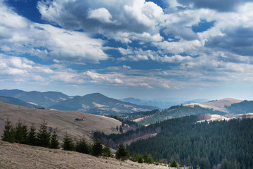 mountain views with cloudy sky and traveling tourists in the Ukrainian Carpathians