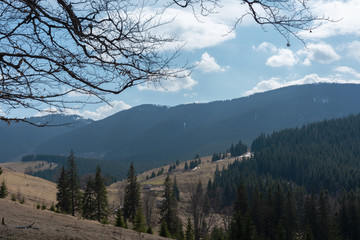 mountain views with cloudy sky and traveling tourists in the Ukrainian Carpathians