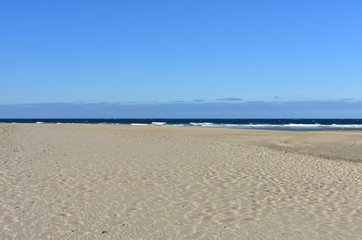 Fototapeta na wymiar Beach with waves and blue sky. Galicia, Spain.