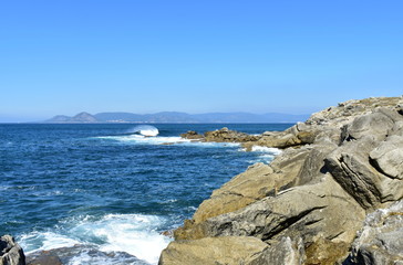 Cliff with waves breaking. Galicia, Spain.