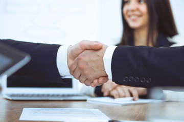 Business people shaking hands at meeting or negotiation in the office. Handshake concept. Partners are satisfied because signing contract