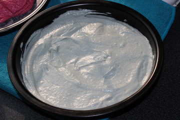 baking a multicoloured cake
