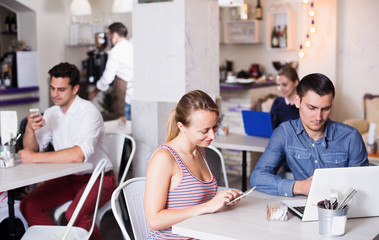 Young couple spending time together in cozy cafe