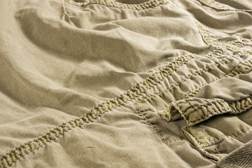 clothing items washed cotton fabric texture with seams, clasps, buttons and rivets