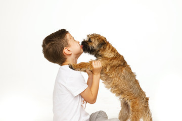 little boy in chocolate with his dog