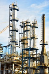 Close-up of pipelines and destillation tanks of an oil-refinery plant