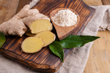 Ginger and lemon on a wooden background, Photo in a rustic style. Ingredients for warming and health drink. Alternative medicine. Free space for text