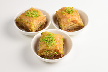 Pistachio baklava on a white background. Dessert.