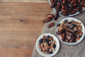 bowl of mixed dry fruits and nuts on wooden table