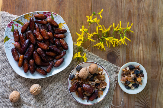 bowl of mixed dry fruits and nuts on wooden table