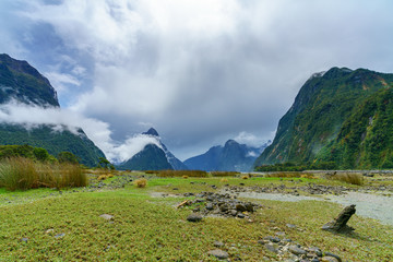 mountains in the clouds, milford sound, fiordland, new zealand 2