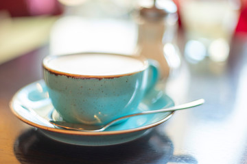 cappuccino in a cup on the table. selective focus