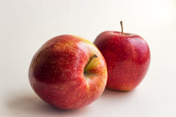 bright red apples on white background