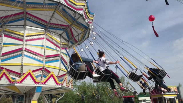 amusement machine in a luna park - swing wheel chairs