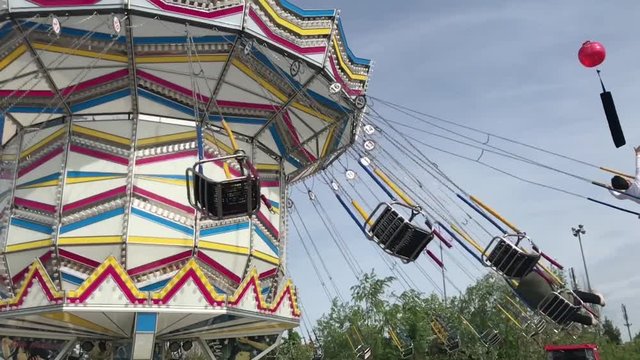 amusement machine in a luna park - swing wheel chair