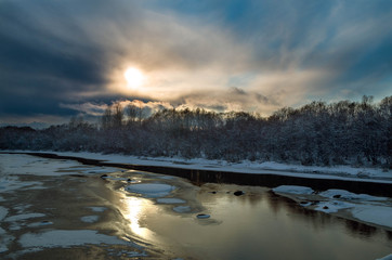 River in spring against the blue sky with clouds
