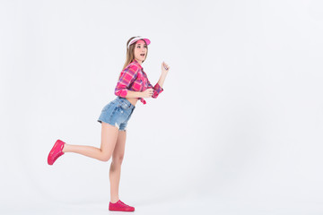 Sportive and pretty girl run while staying on white background! Copy space!