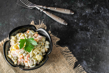 Traditional Russian Christmas and New year salad Olivier . Selective focus