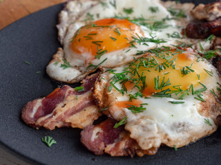 Fried eggs with bacon and smoked Turkey breast