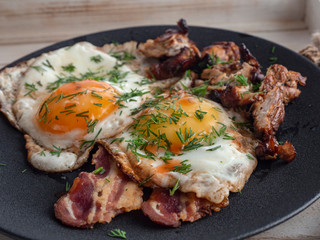 Fried eggs with bacon and smoked Turkey breast