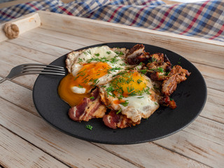 Fried eggs with bacon and smoked Turkey breast